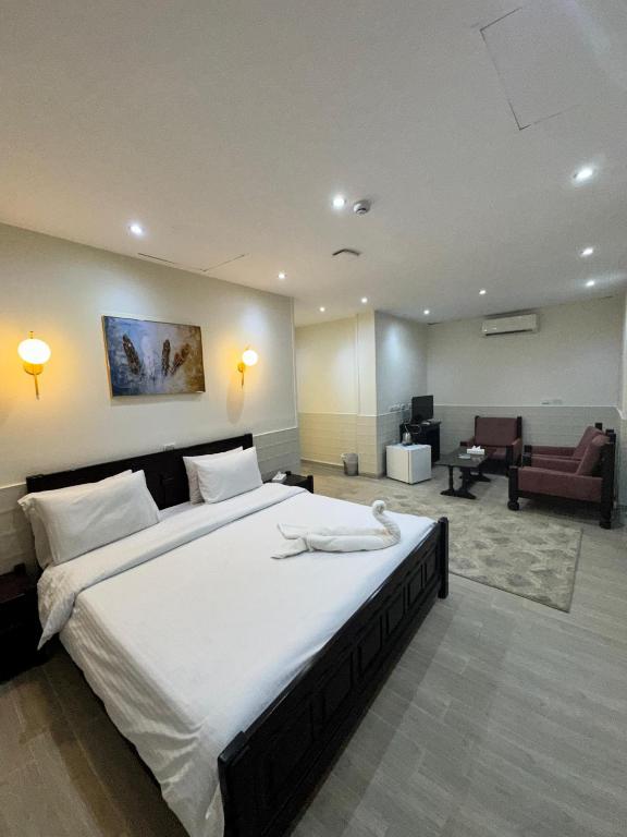Postel nebo postele na pokoji v ubytování New Star Zamalek Hotel