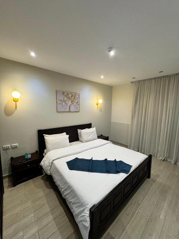 Postel nebo postele na pokoji v ubytování New Star Zamalek Hotel