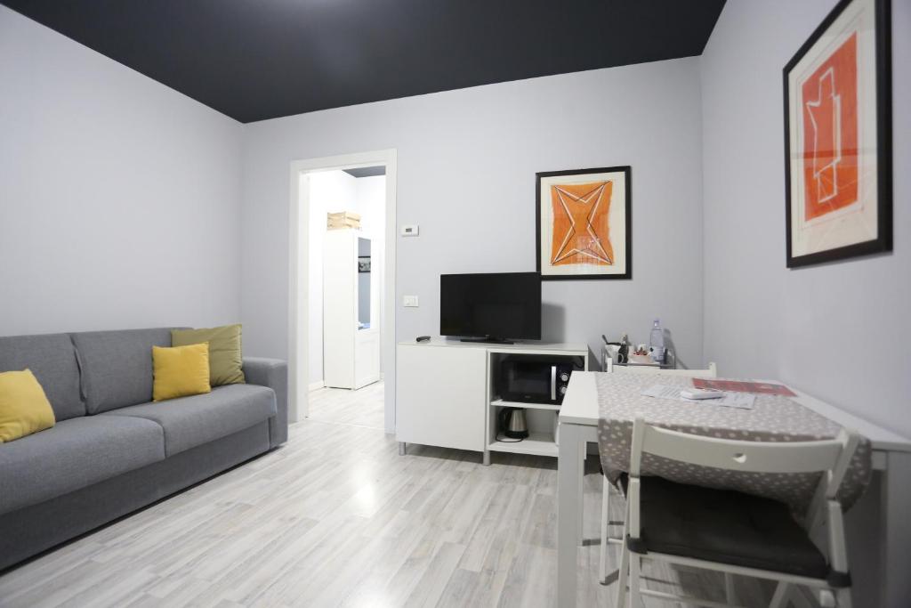 a living room with a couch and a table at New Ulivo Apartment 2 in Seriate