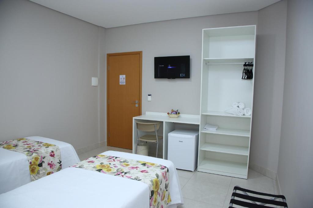 Postel nebo postele na pokoji v ubytování Ventura Hotel