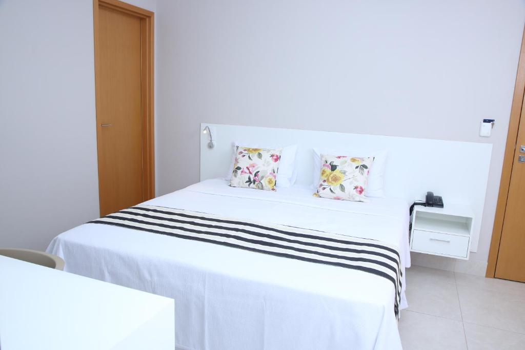 Postel nebo postele na pokoji v ubytování Ventura Hotel