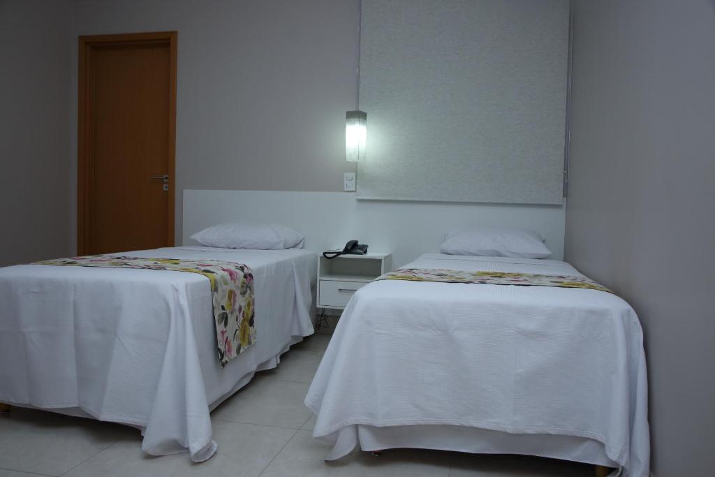 Postel nebo postele na pokoji v ubytování Ventura Hotel