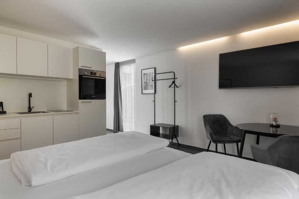 Postel nebo postele na pokoji v ubytování Motel by Maier Feldkirch - kontaktloser Check-in