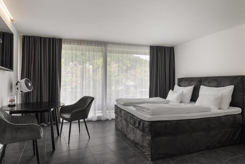 Postel nebo postele na pokoji v ubytování Motel by Maier Feldkirch - kontaktloser Check-in