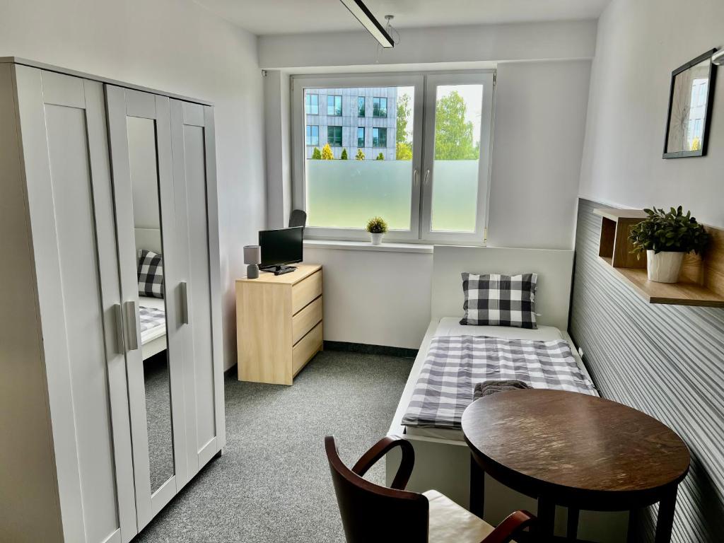 Posteľ alebo postele v izbe v ubytovaní Astra Katowice - Aparthotel