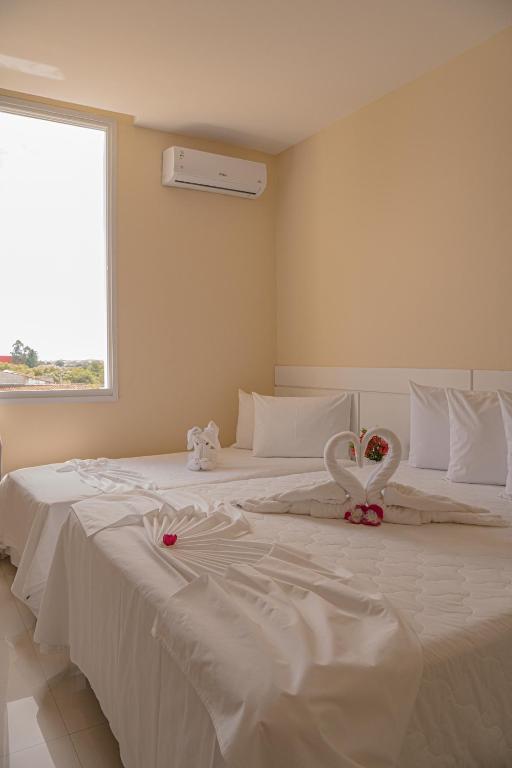 Postel nebo postele na pokoji v ubytování Hotel Porto Napolis