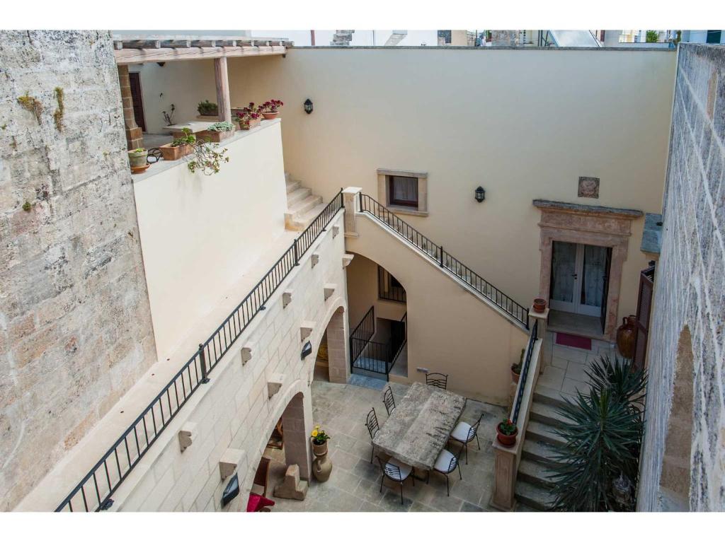 an overhead view of a staircase in a building at Palazzo Mellacqua in Andrano