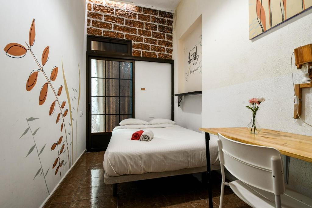 Postel nebo postele na pokoji v ubytování Drago Hostel