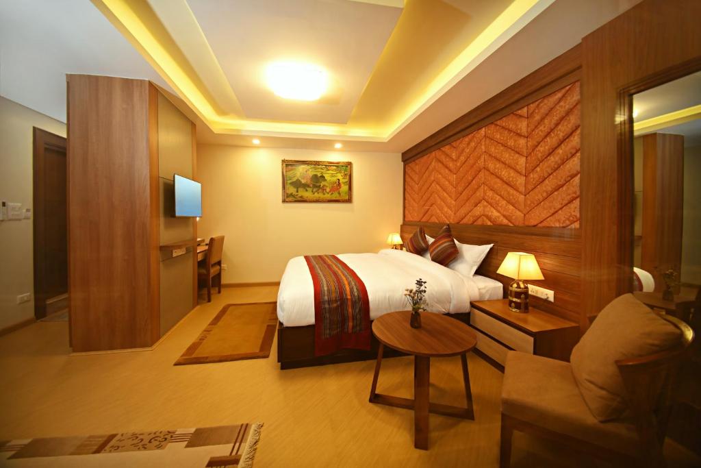 Postel nebo postele na pokoji v ubytování Hotel Sherpani