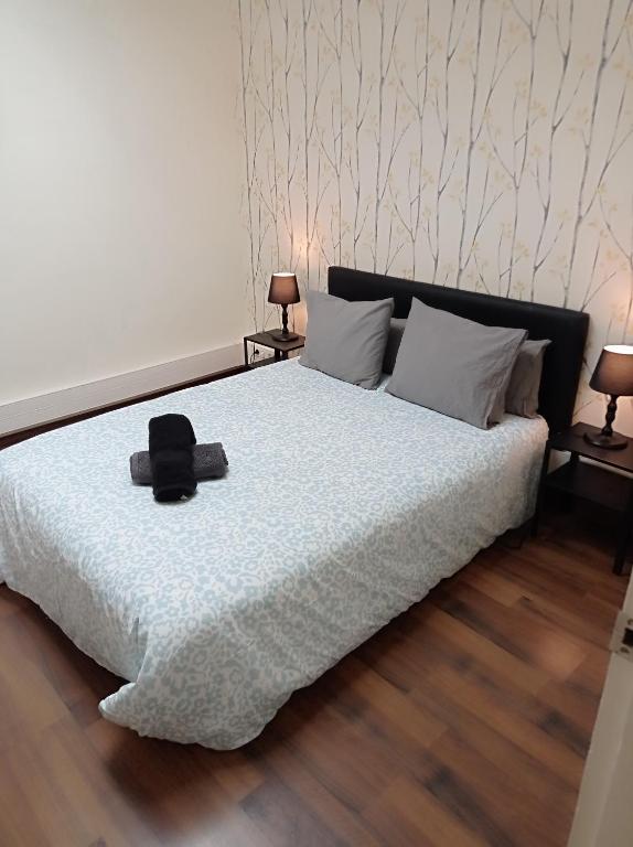 Ένα ή περισσότερα κρεβάτια σε δωμάτιο στο Double Rooms Balmes-Padua