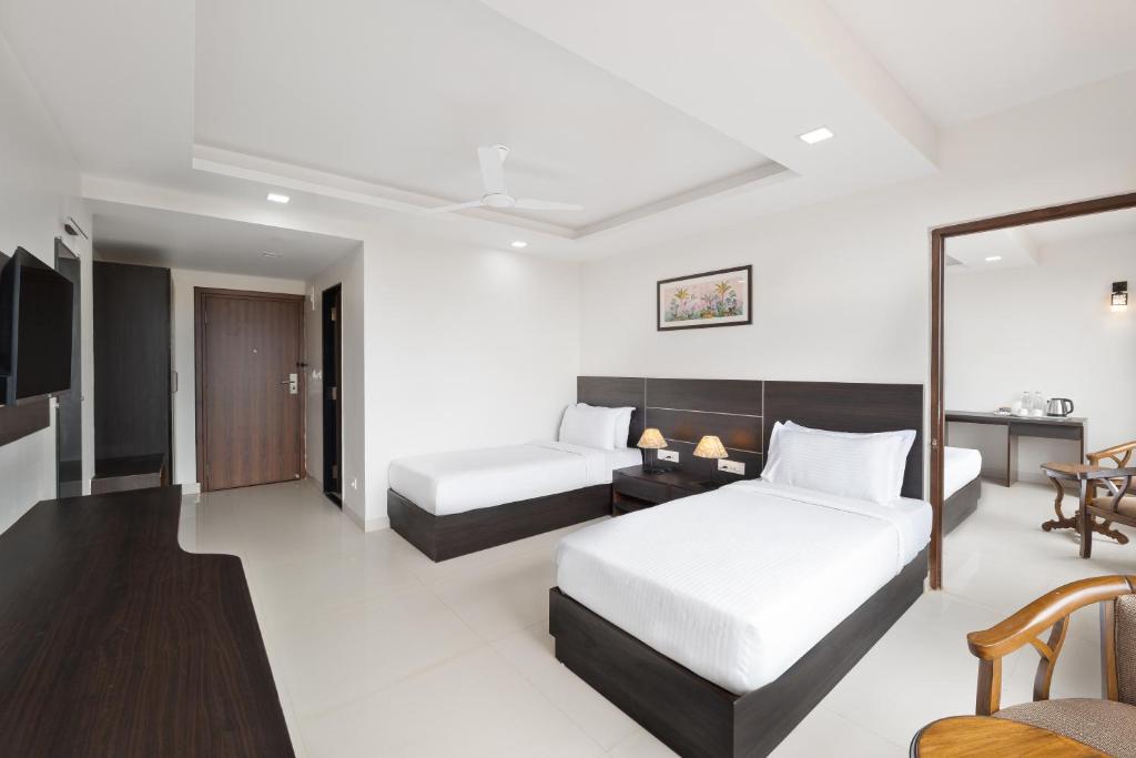 Postel nebo postele na pokoji v ubytování BSG Porvorim Regency Hotel Goa