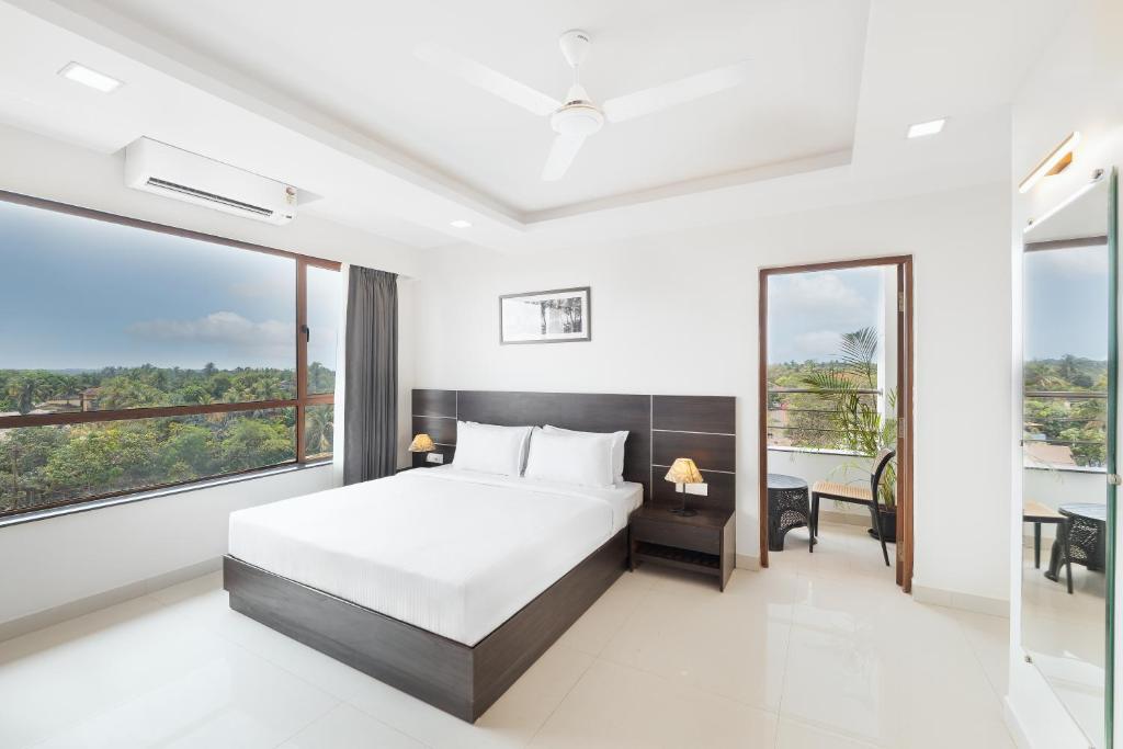 Postel nebo postele na pokoji v ubytování BSG Porvorim Regency Hotel Goa