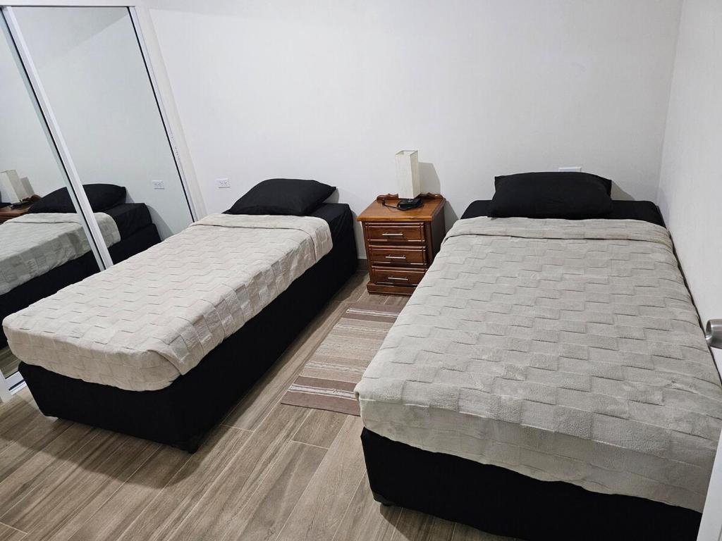Postel nebo postele na pokoji v ubytování Sunset Cove