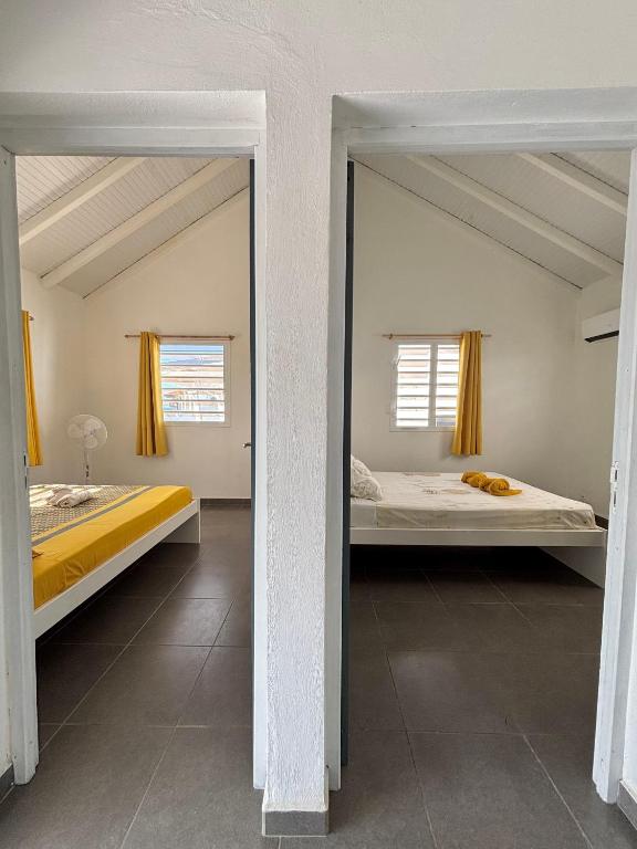 Postel nebo postele na pokoji v ubytování Gîte Tournesol - À 2 min de la plage et du bourg