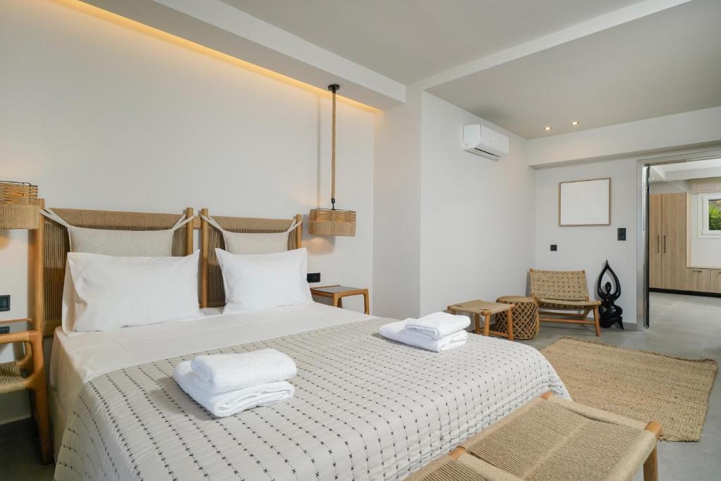 A bed or beds in a room at Apollonia by Stone Village