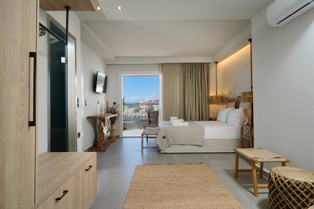A bed or beds in a room at Apollonia by Stone Village