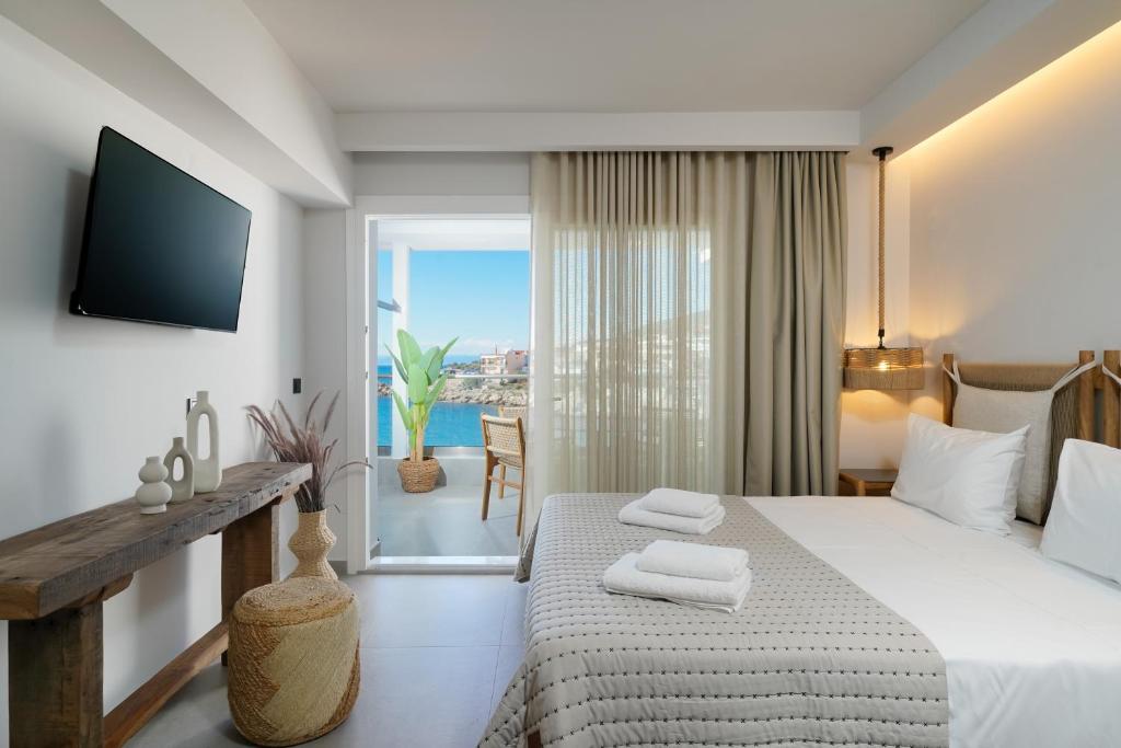 A bed or beds in a room at Apollonia by Stone Village