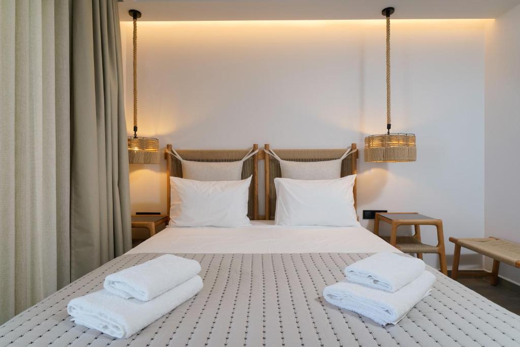 A bed or beds in a room at Apollonia by Stone Village