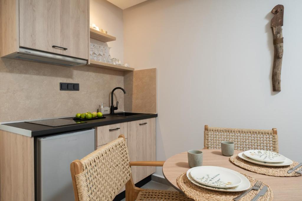 A kitchen or kitchenette at Apollonia by Stone Village