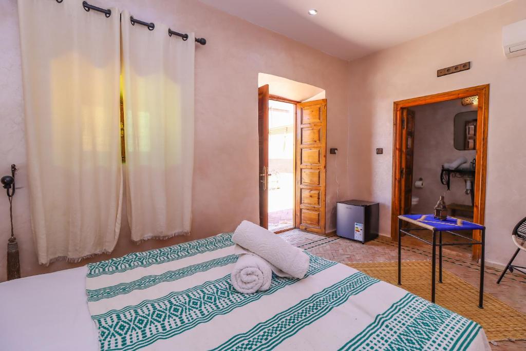 Postel nebo postele na pokoji v ubytování Maison D'hôte Zomorroda