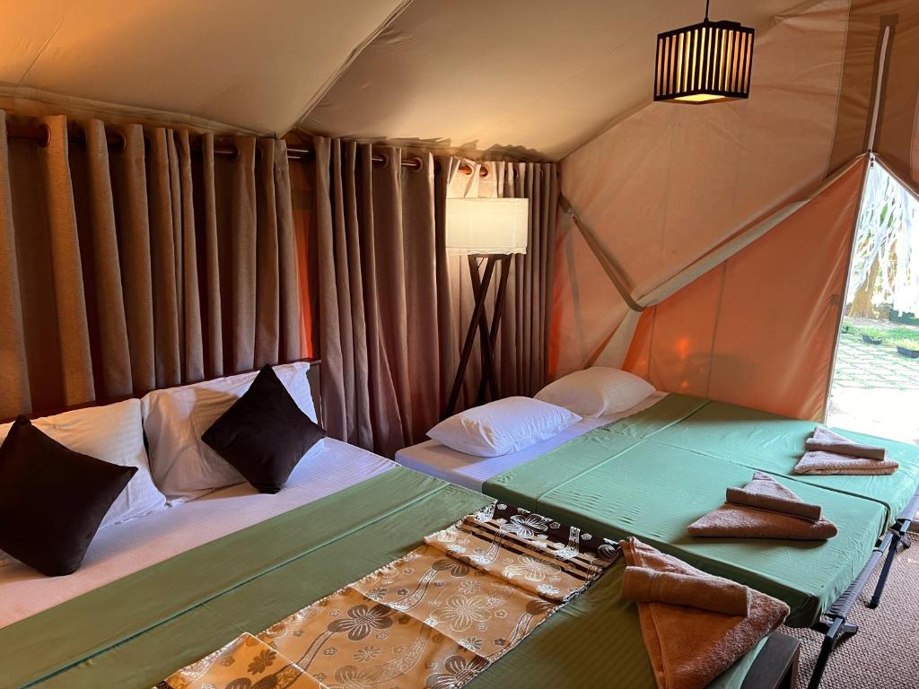 Postel nebo postele na pokoji v ubytování AT ONE - with Nature Glamping Resort