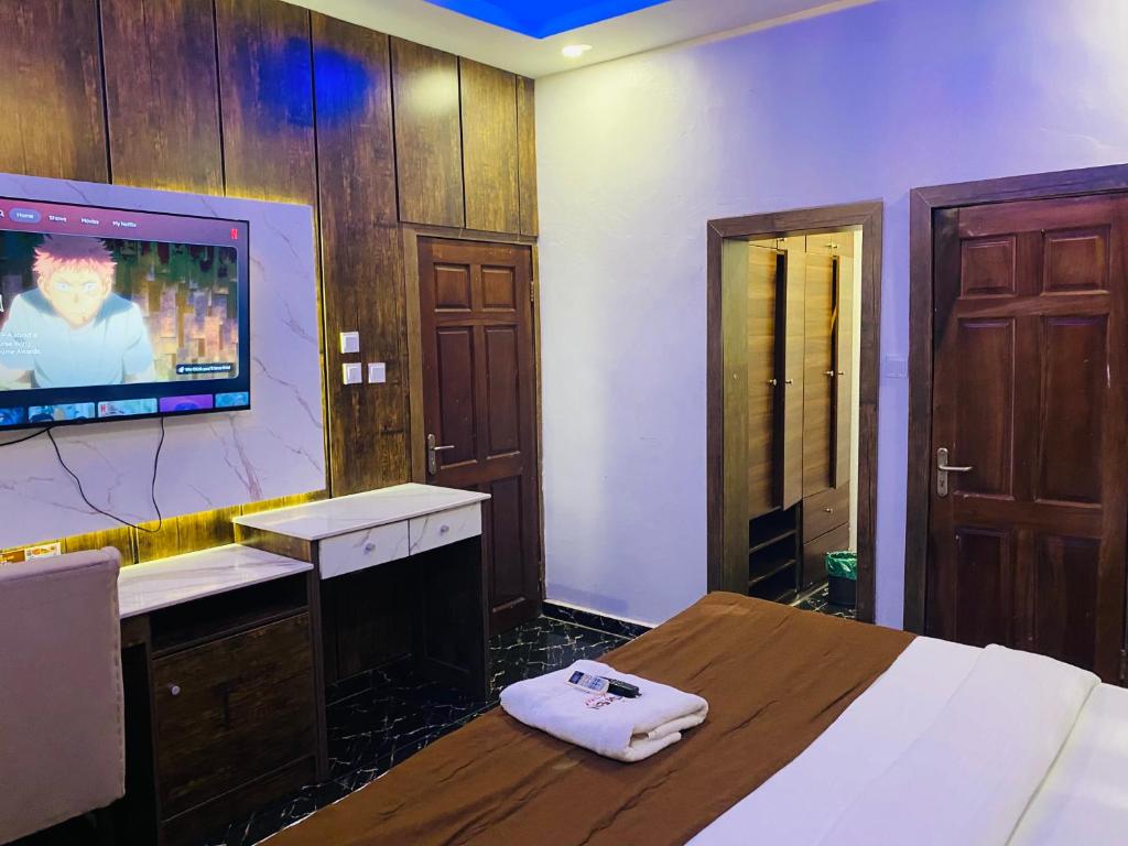 TV a/nebo společenská místnost v ubytování Presken Hotel @Oniru