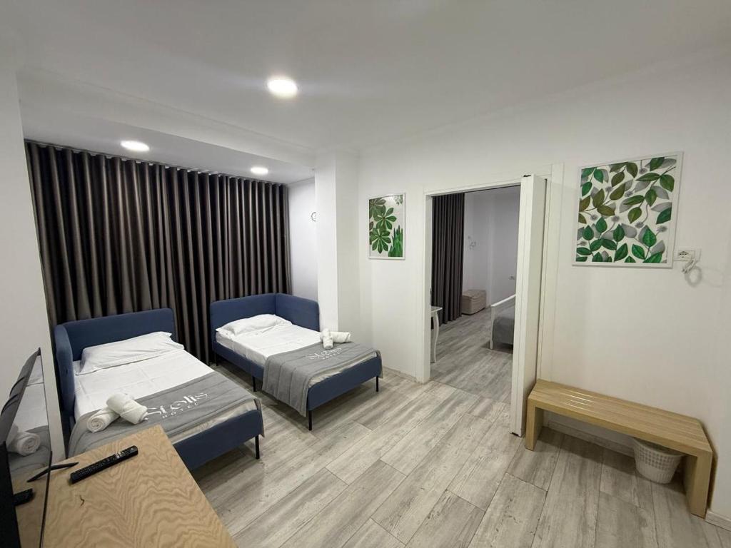 Postel nebo postele na pokoji v ubytování Hotel Stolis