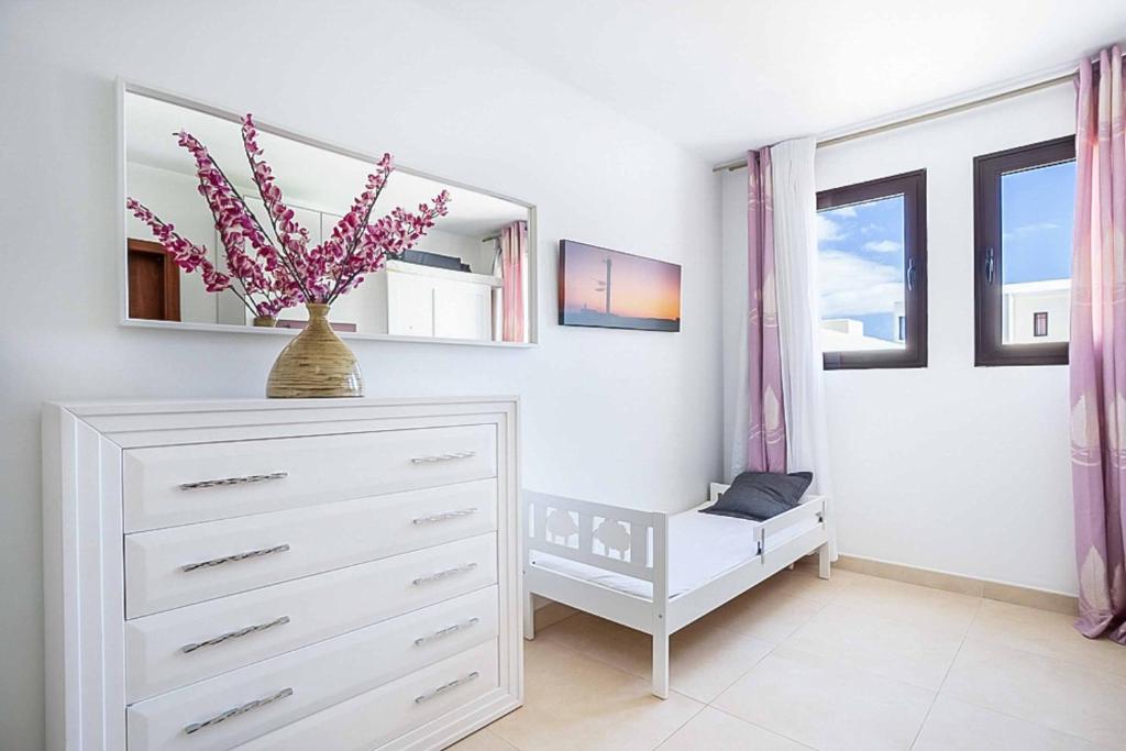 Postel nebo postele na pokoji v ubytování Villa Perla