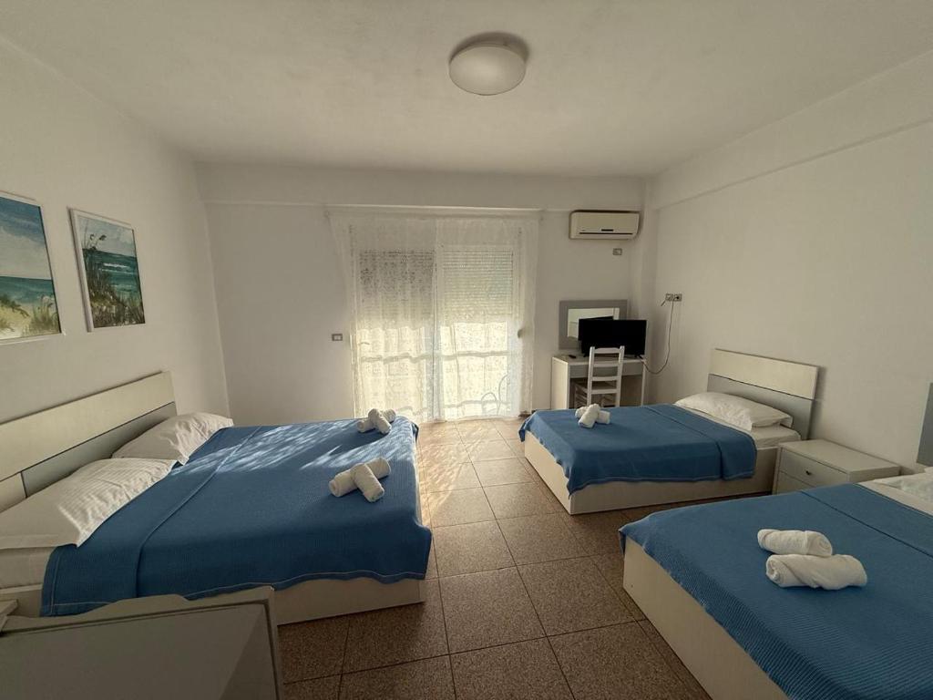 Postel nebo postele na pokoji v ubytování Hotel Stolis