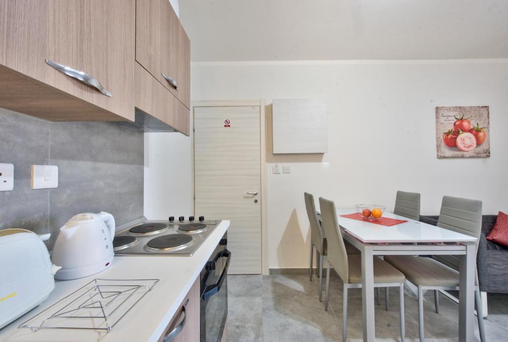 Kuchyň nebo kuchyňský kout v ubytování Central Suites