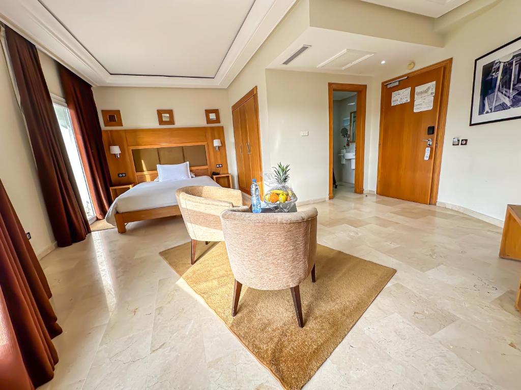 Postel nebo postele na pokoji v ubytování Hotel LA PALOMA