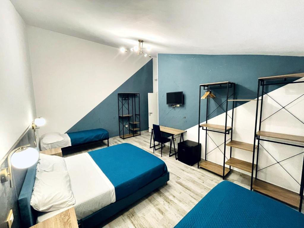 Postel nebo postele na pokoji v ubytování Nautilus B&B