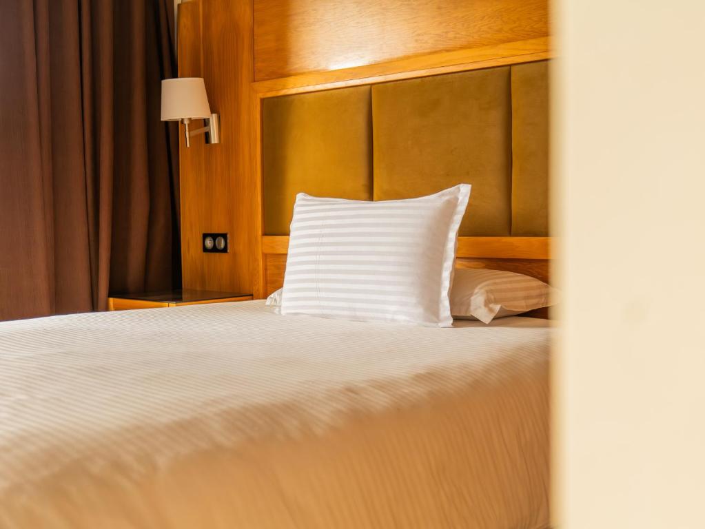 Postel nebo postele na pokoji v ubytování Hotel LA PALOMA