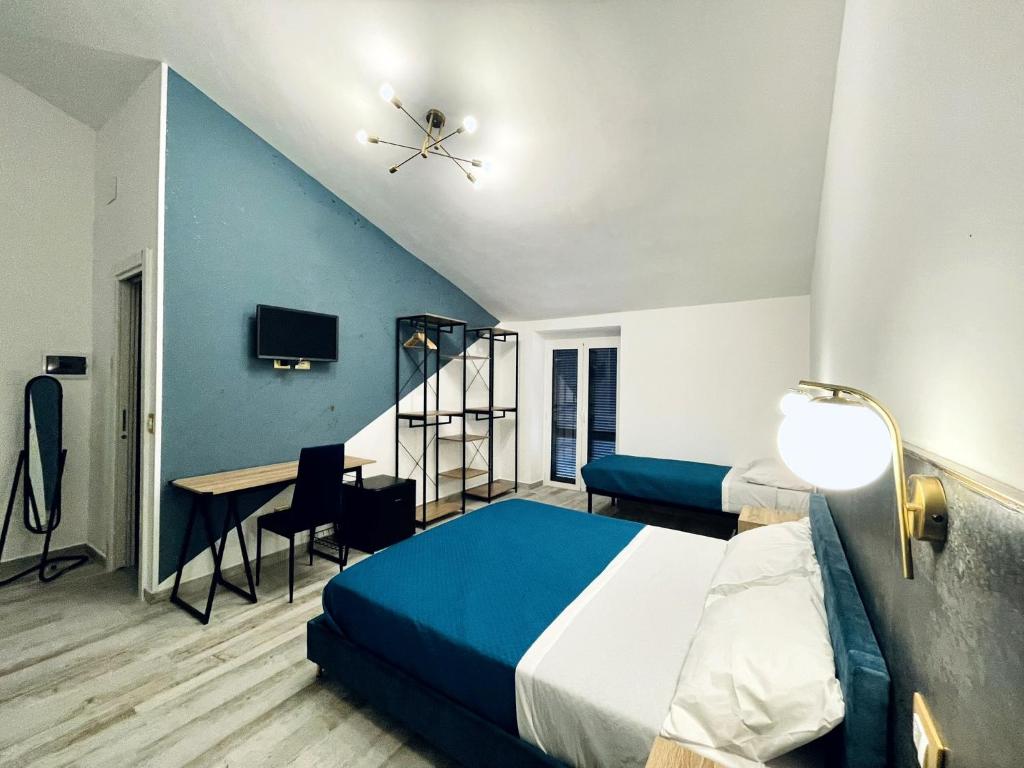 Postel nebo postele na pokoji v ubytování Nautilus B&B