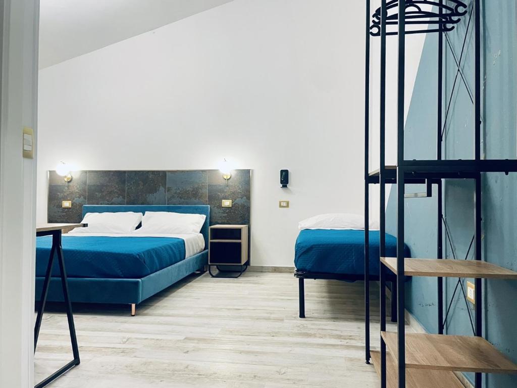 Postel nebo postele na pokoji v ubytování Nautilus B&B