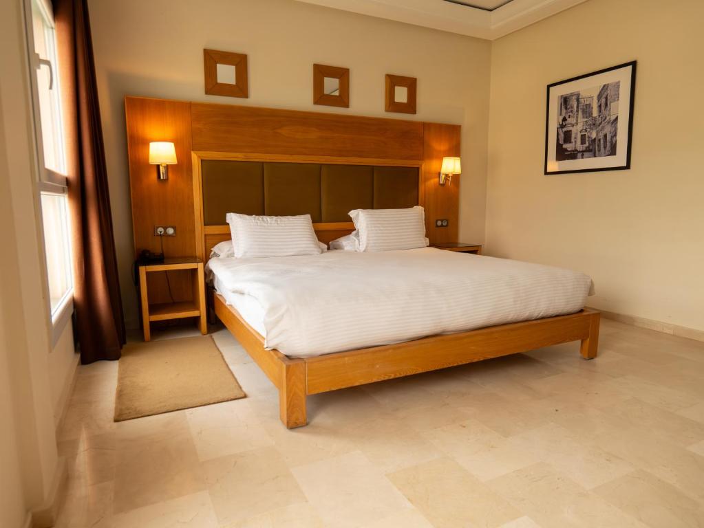 Postel nebo postele na pokoji v ubytování Hotel LA PALOMA
