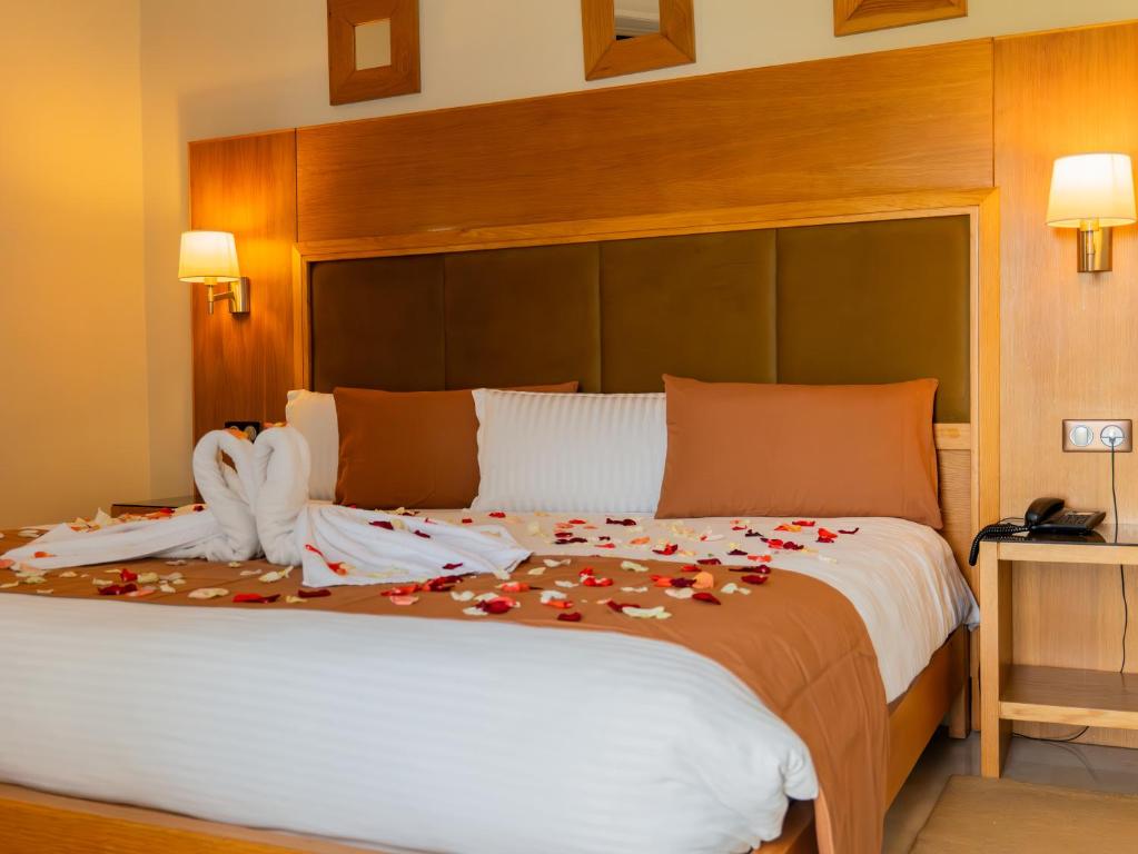 Postel nebo postele na pokoji v ubytování Hotel LA PALOMA