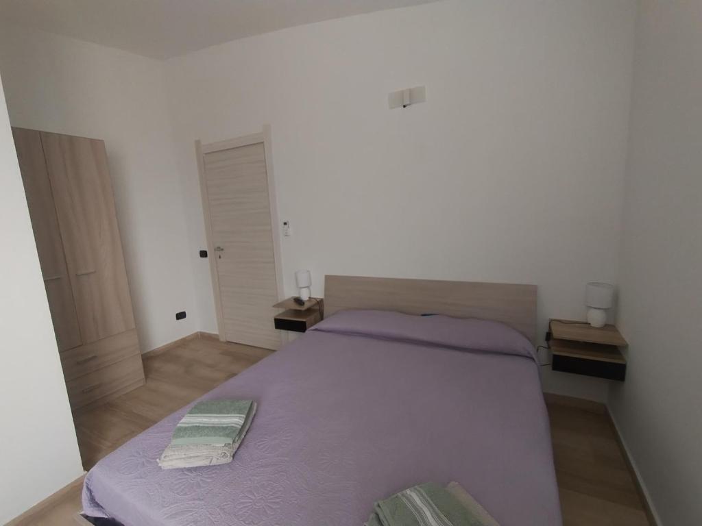 Posteľ alebo postele v izbe v ubytovaní la perla dello ionio