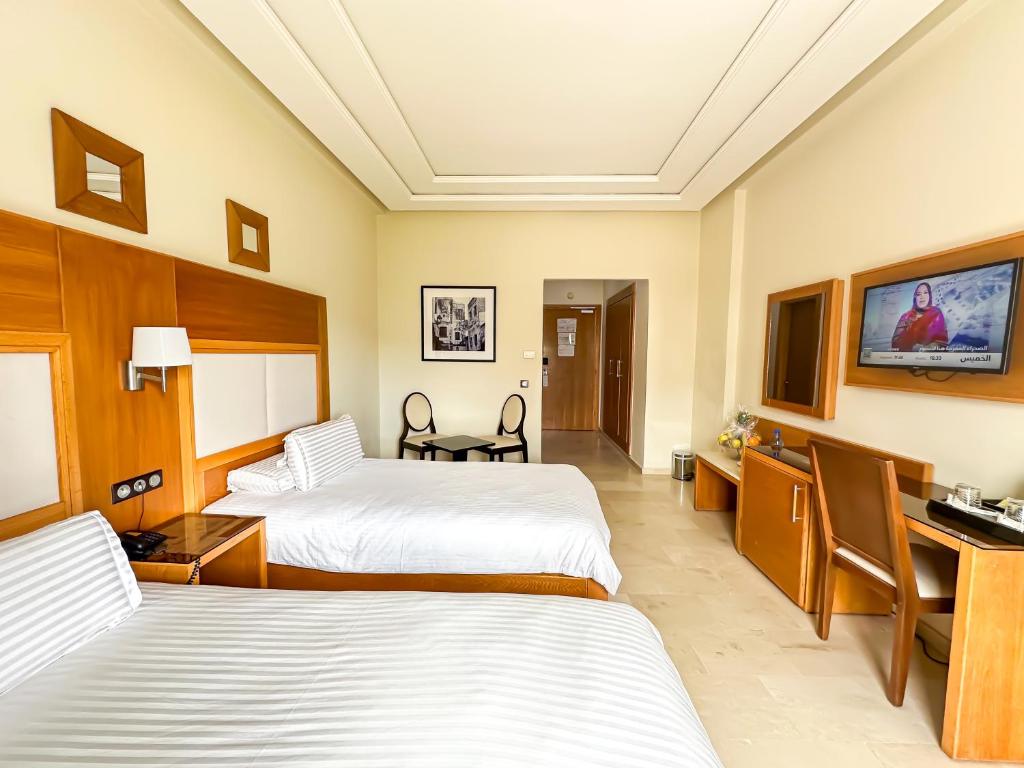 Postel nebo postele na pokoji v ubytování Hotel LA PALOMA