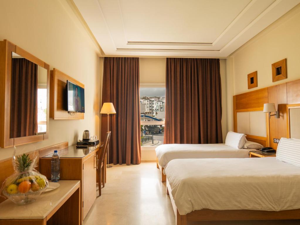 Postel nebo postele na pokoji v ubytování Hotel LA PALOMA