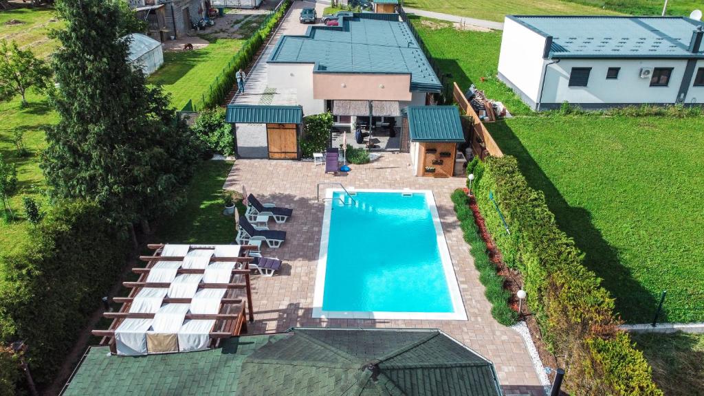 an overhead view of a house with a swimming pool at Delta apartments in Bihać