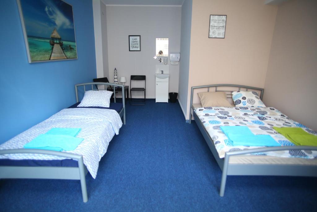 Ένα ή περισσότερα κρεβάτια σε δωμάτιο στο HELLO Gdynia Hostel