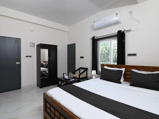 Postel nebo postele na pokoji v ubytování SS INN Hotel