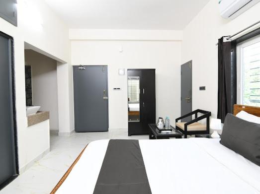 Postel nebo postele na pokoji v ubytování SS INN Hotel