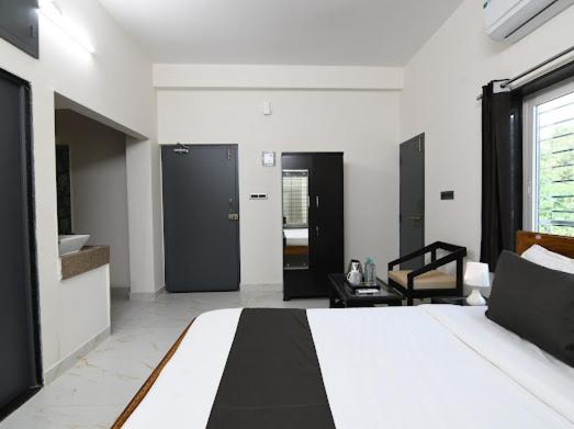 Postel nebo postele na pokoji v ubytování SS INN Hotel