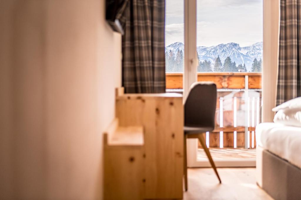 Postel nebo postele na pokoji v ubytování Hotel Antholzerhof