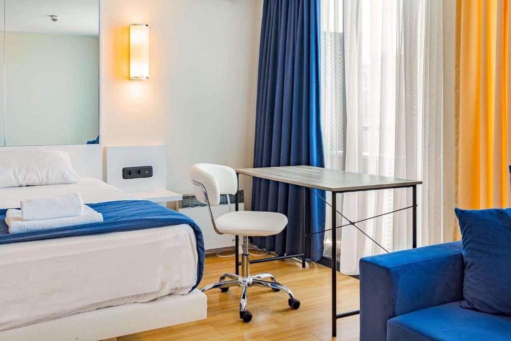 Postel nebo postele na pokoji v ubytování New Orbi City Suite