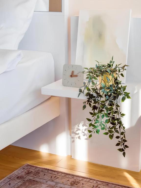 Postel nebo postele na pokoji v ubytování New Orbi City Suite