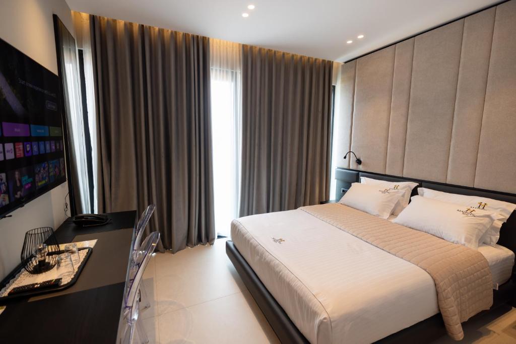Postel nebo postele na pokoji v ubytování Hotel Majestic