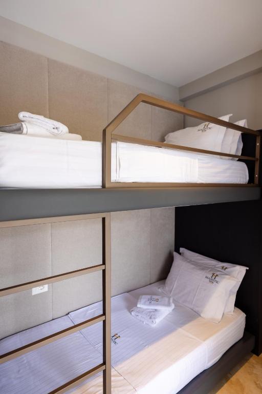 Postel nebo postele na pokoji v ubytování Hotel Majestic